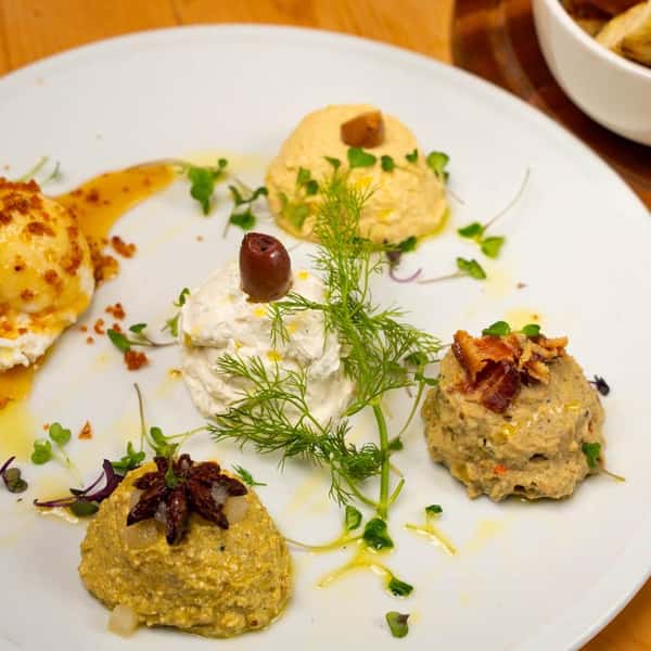 A plate of five of artisanal spreads