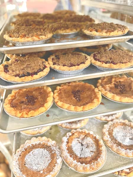 a rack full of freshly baked pies
