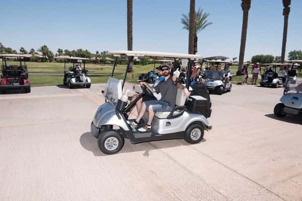 people in golf cart