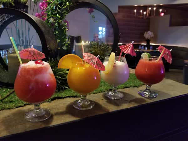 4 different kinds of daiquiris on a table