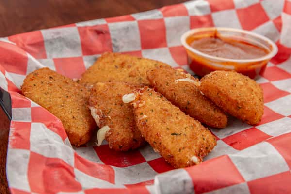 Fried mozzarella sticks served on checkered paper with a side of marinara dipping sauce.