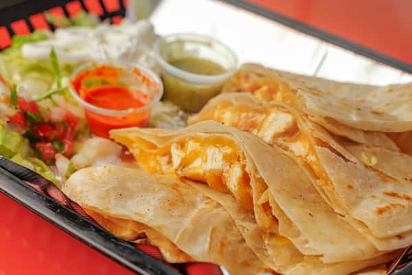 A Large Quesadilla With Meat at Señor Burrito Company