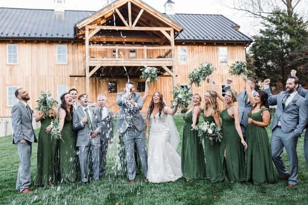 A photo of the wedding party outside Oak Barn at Loyalty