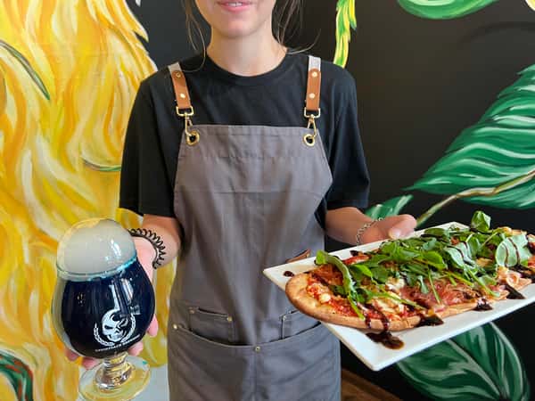Server with food and cocktail