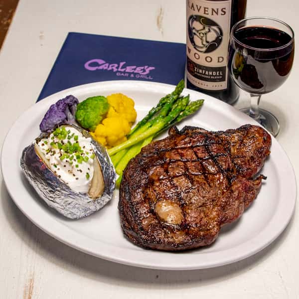 large ribeye steak and veggies
