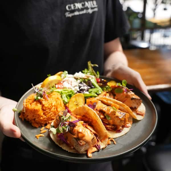 Taste the tropics in every single bite. 🌴🌮

​Our Mahi Mahi Tacos feature perfectly seasoned mahi fish topped with vibrant tropical salsa, crisp sautéed cabbage, and a drizzle of rich Mexican aioli.

​It gets better: every order comes paired with warm rice and our signature tropical salad—a refreshing mix of greens, juicy strawberries, sweet plantains, fresh cheese, and crunchy pumpkin seeds, all tossed in a house-made Dijon passion fruit dressing. 🥗✨

​Stop by today and turn your lunch break into a beach vacation.