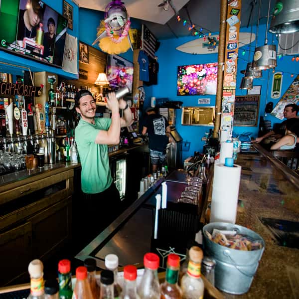 Bartending shaking away behind the bar