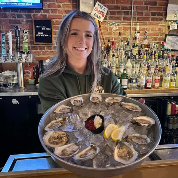 Morgan with a plate of raw oysters