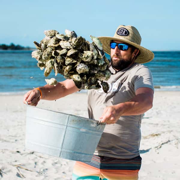 Tossing Steamed Oysters at the Beach