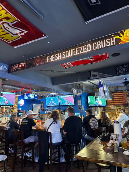 Customers hanging around the bar in Frederick