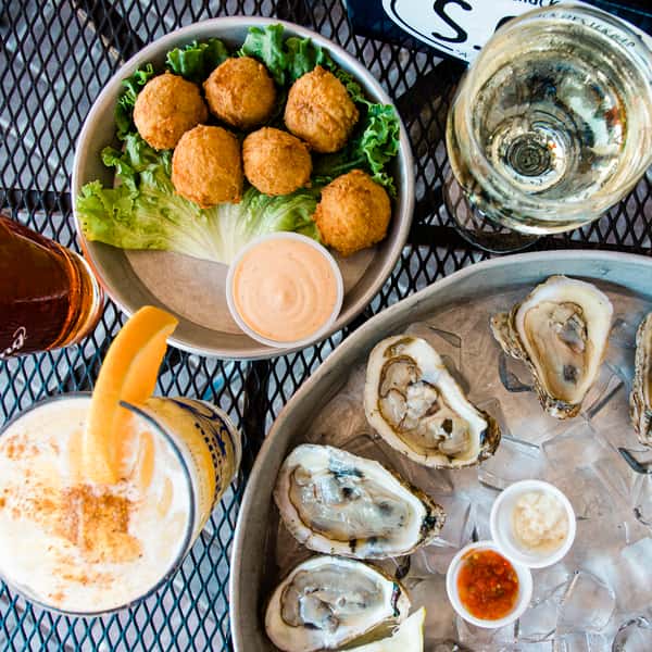 Oysters, Painkiller, Wine, and Crab Balls