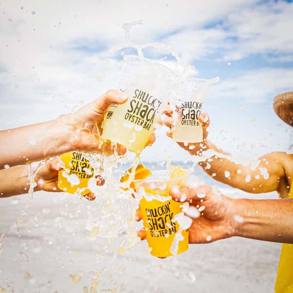 beer toast by the beach