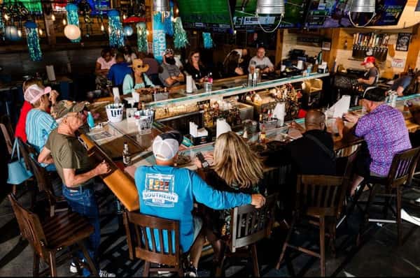 Customers hanging around the bar