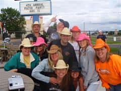 People standing with cowboy hats