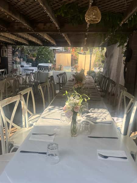 Elegant white tablecloths in the trellis