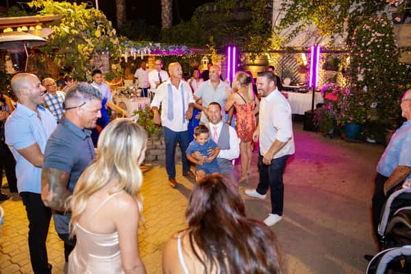 Friends gathered at wedding reception; photo credit Karen D Photography