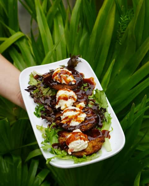 A Southern classic with a Bohemian Bull twist 🍅🔥

Fried green tomatoes topped with pepper jack pimento cheese, chipotle BBQ sauce, and served over mixed greens. Crispy, creamy, smoky, every bite hits.

#FriedGreenTomatoes #SouthernClassic #BohemianBull #CharlestonSCFood #JamesIsland