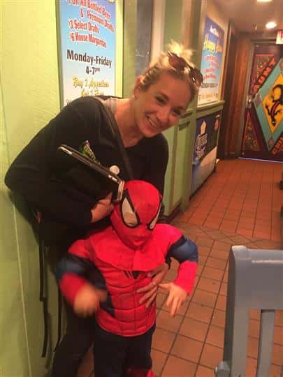 a woman and her son dressed as spiderman