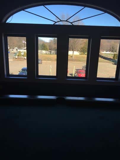 a view of the outside through five windows