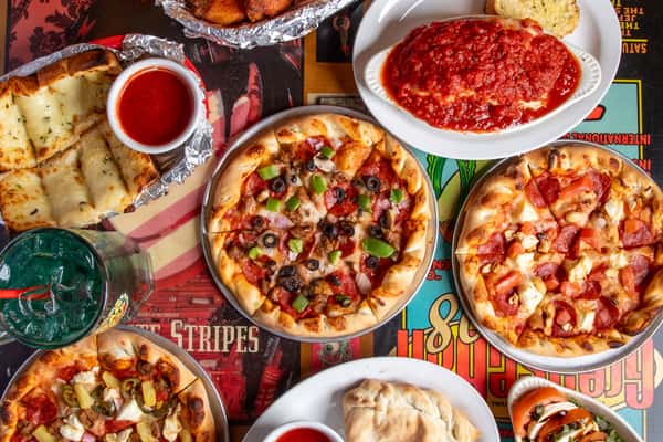 Hero shot of Pizzas and pasta