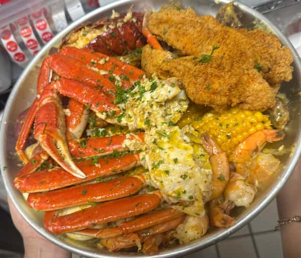 Big back boil: 2 snow crab clusters, 1 lobster tail, 10 shrimp, 6wings, 2catfish, 4potatoes, 4eggs, 4corn