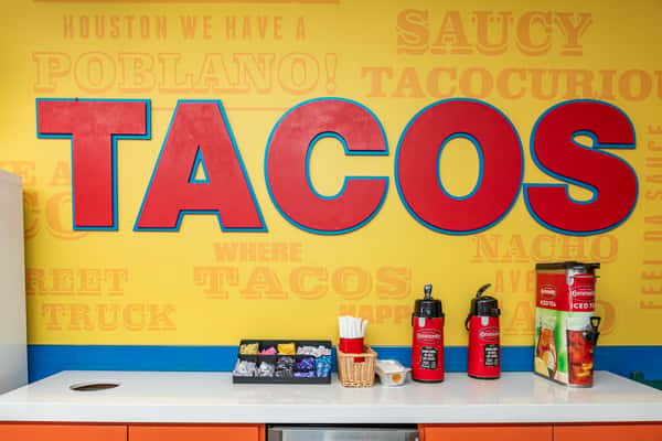 Interior mural of the word "Tacos"