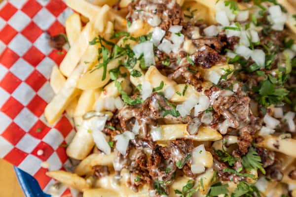 Fries with cheese in a basket