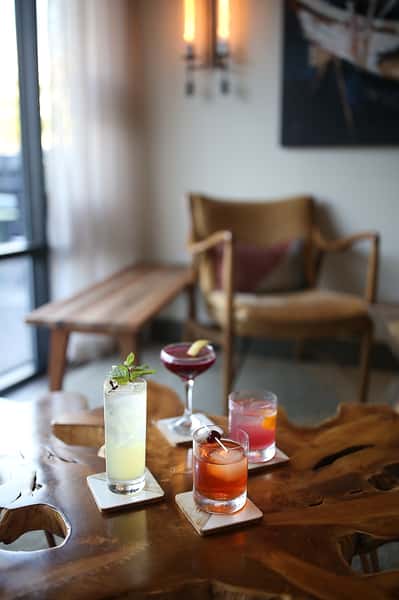 Assorted cocktails arranged on the table in the living room area of Town Hall restaurant.