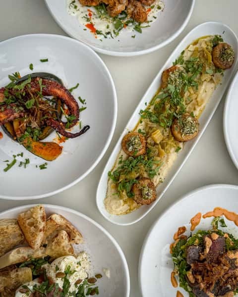 Assorted dishes at Town Hall to include the Seared Scallops and Octopus.