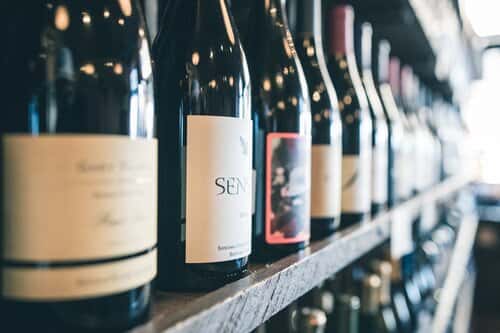 Photo of bottles of wine on a shelf