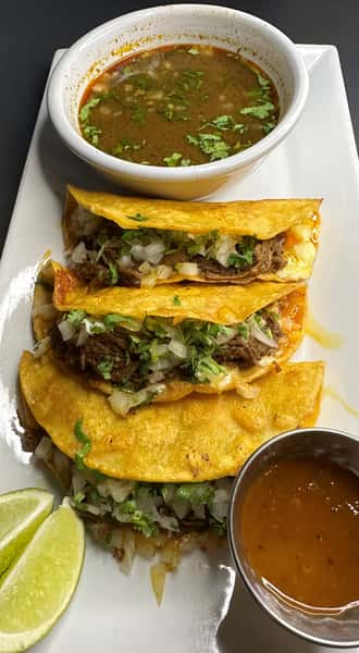 three birria tacos on a plate