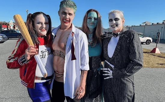 Four people dressed in costume for a rally