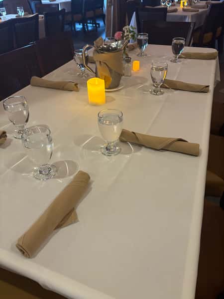 Upham room table setup with candle