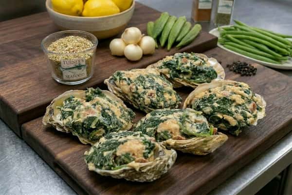 Six oyster Rockefeller with lemons, green beans, and spices