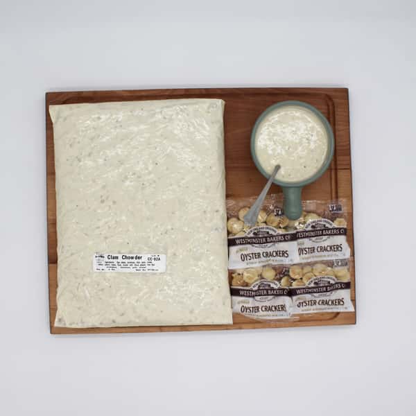 Clam chowder in a bag and cup with osyster crackers on display board