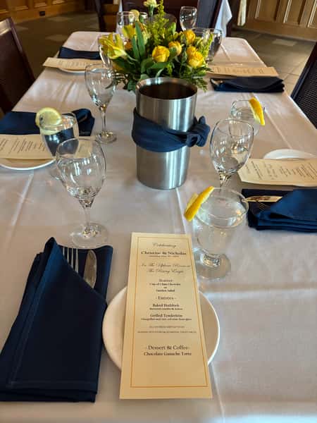 Upham Room Rehearsal, blue napkins, yellow rose