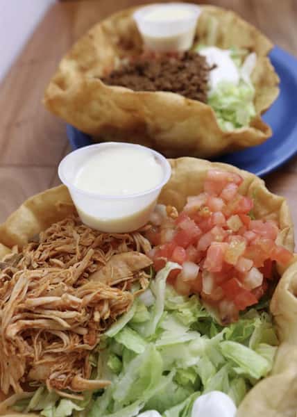 pulled pork taco salad with lettuce, pico and a side of sour cream