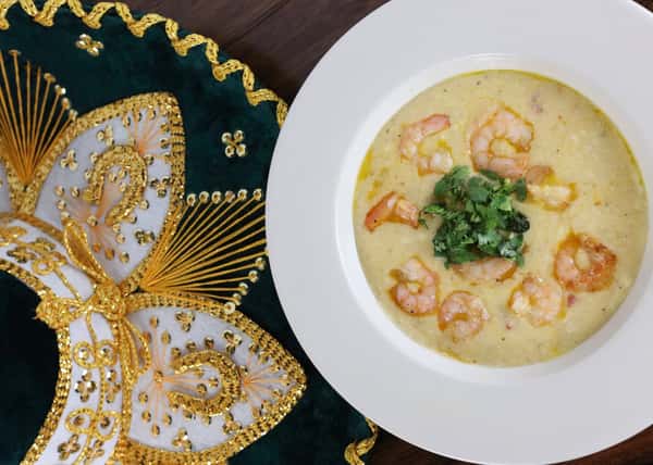 Shrimp and grits with parsley as a garnish