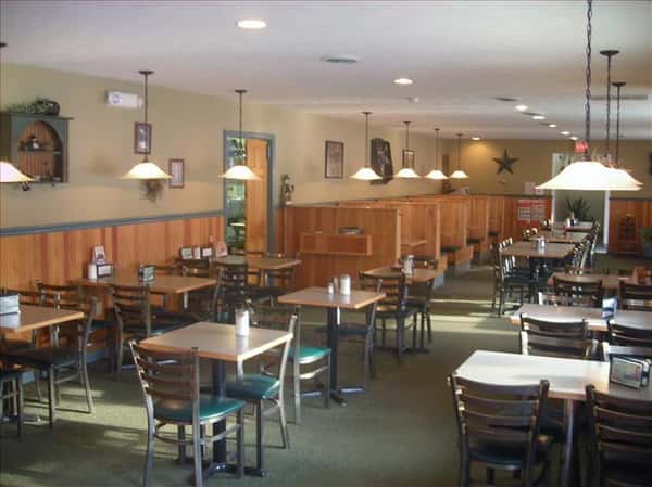 Dining area with chandeliers hanging above