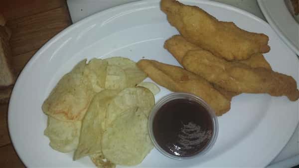 Fish and chips with a side of sauce