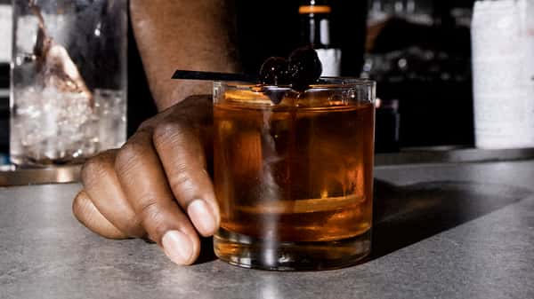 person serving a cocktail