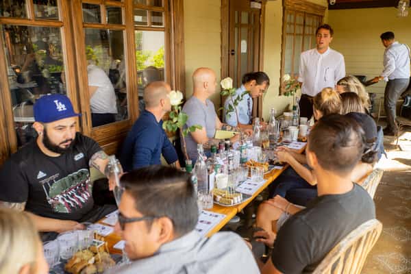table of people tasting liquor