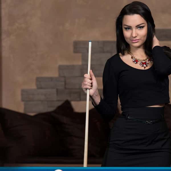 Woman with pool stick