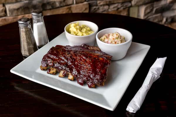 Neil St. Blues' house smoked ribs paired with homemade potato salad and coleslaw.