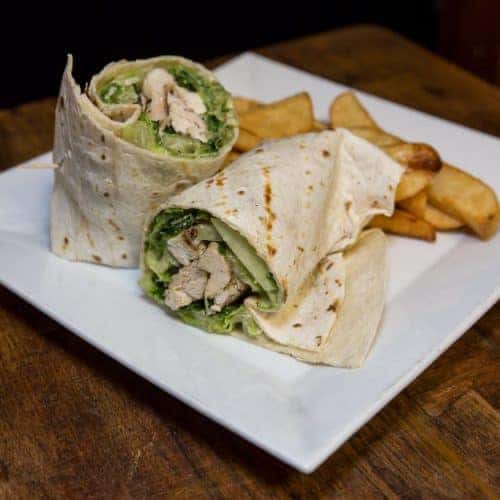 chicken caesar wrap with a side of fries