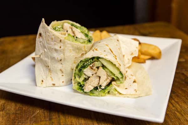 chicken caesar wrap with a side of fries