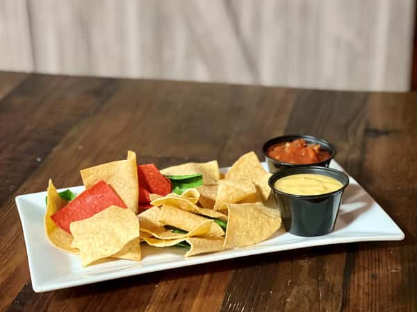 tortilla chips with nacho cheese and salsa on the side
