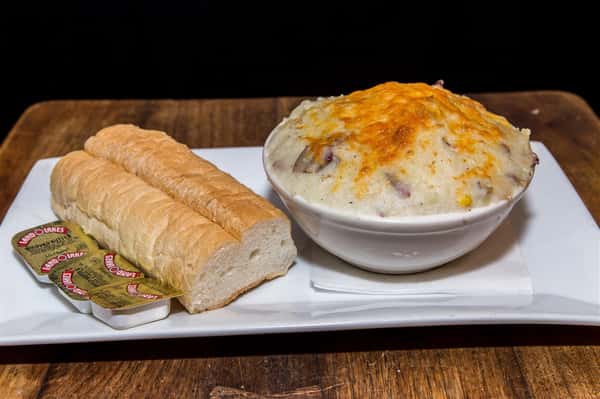 a side of mashed potatoes topped with cheese