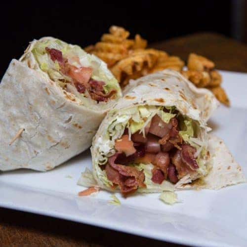 chicken bacon wrap with a side of fries