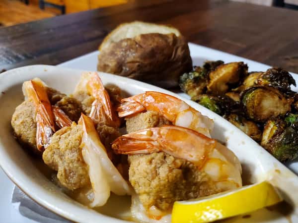 fried shrimp with broccoli and a potato